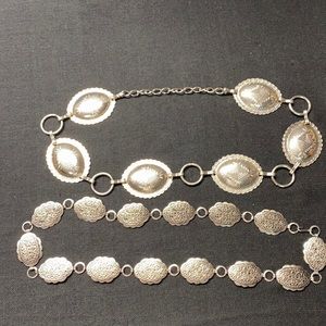 2 metal silver toned belts